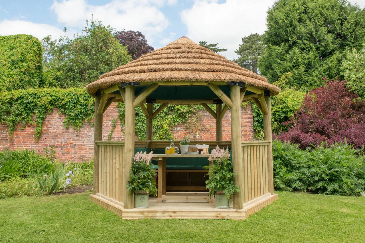 Forest Garden Hexagonal Thatched Roof Gazebo Furnished Green 1 Forest Garden Hexagonal Thatched Roof Gazebo Furnished Green